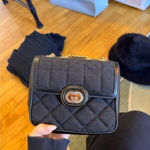 Gucci Black Quilted Mini Bag with Gold Accents